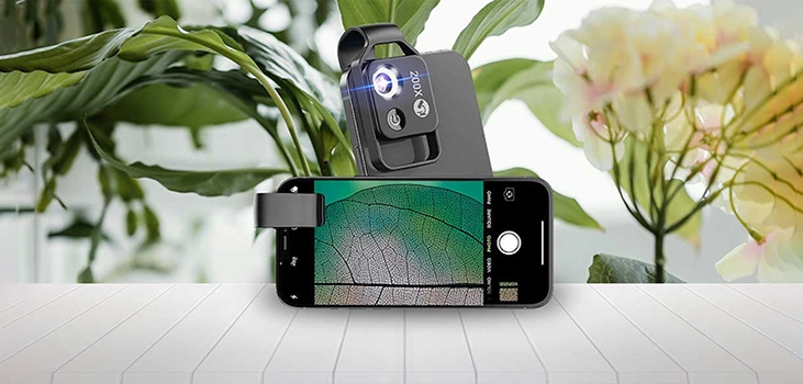 Image of a phone on a table with NanoSight x200 in front of a plant